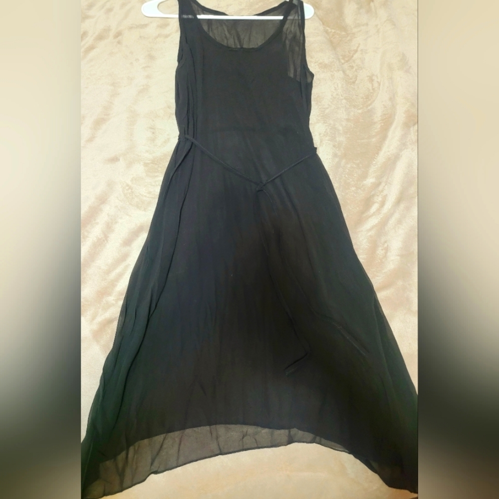 Black sheer dress cover or bathing suit cover.